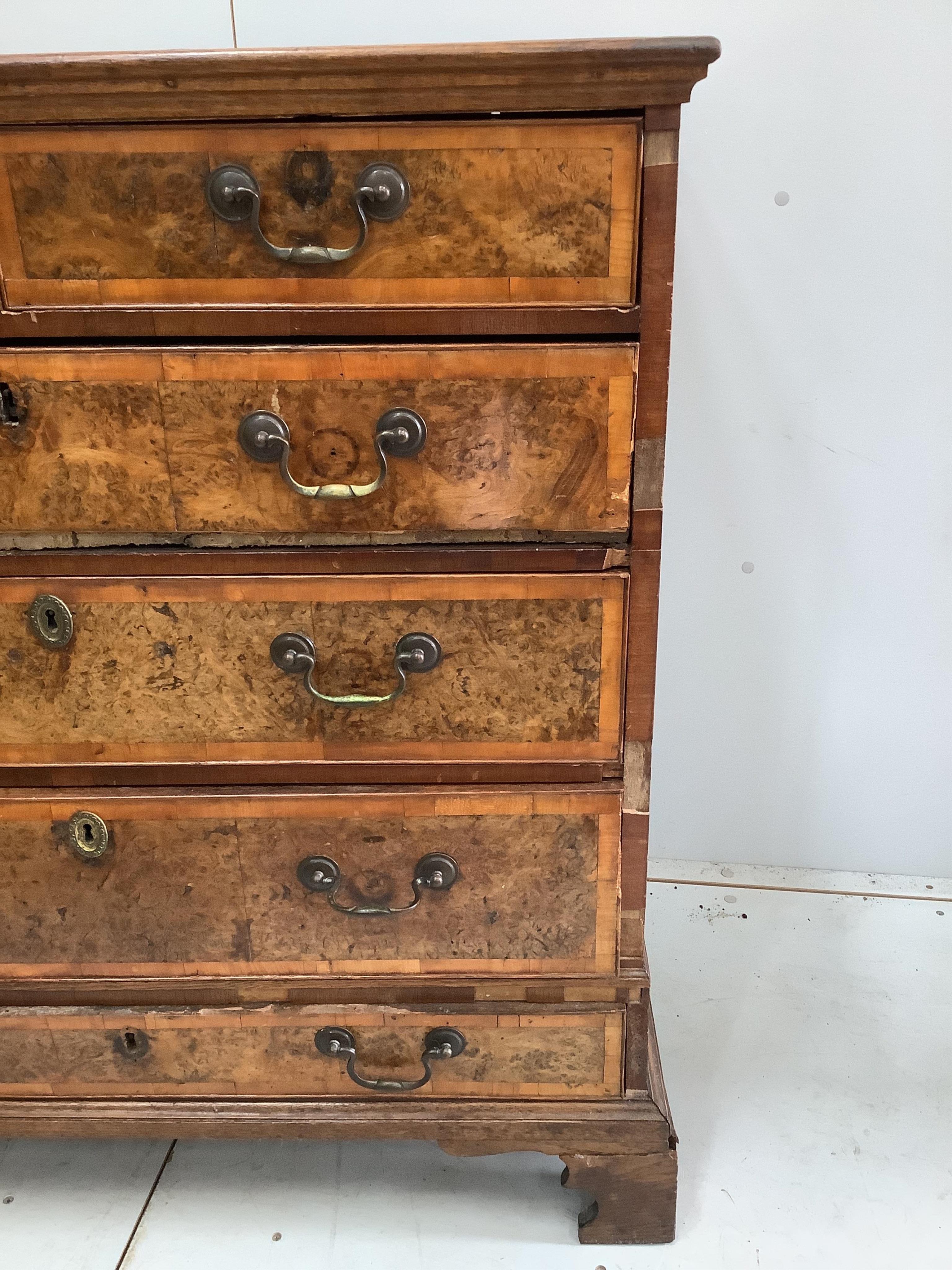 A mid 18th century and later crossbanded walnut and oak chest, width 95cm, height 103cm. Condition - poor